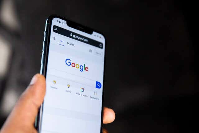 a smartphone with Googles search bar visible