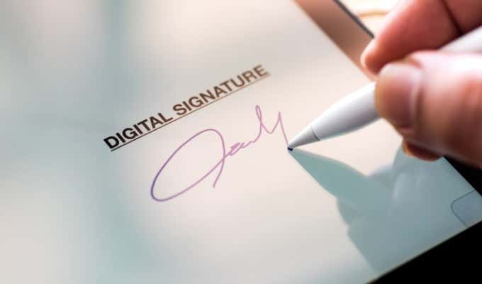 someone signing a document