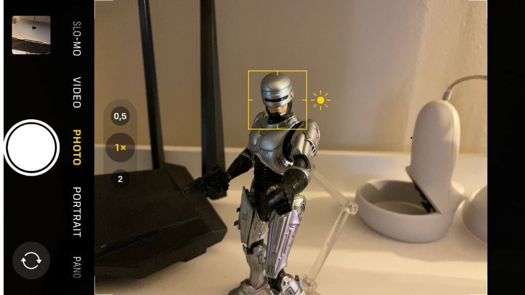 A robot figurine in the Phone camera app viewfinder