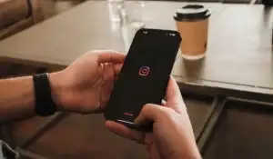 closeup of person using instagram on smartphone
