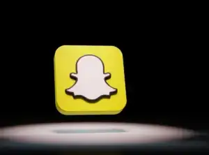 Stylized Snapchat logo floating against black background
