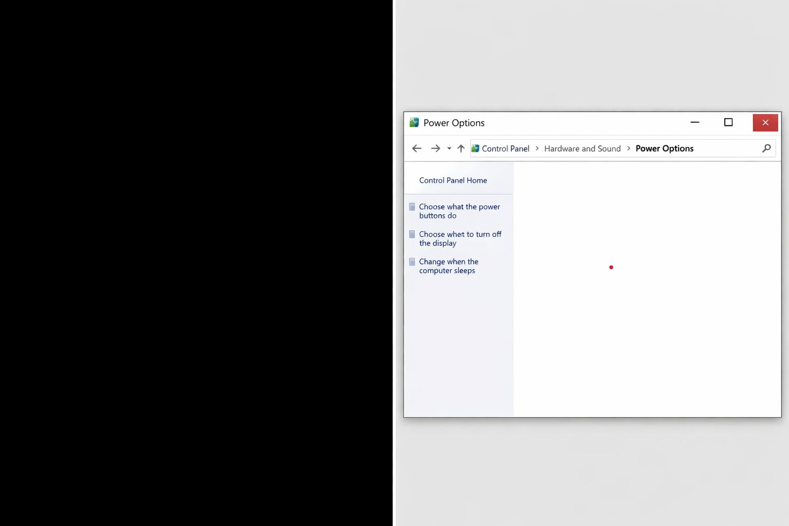 Split screen showing blank monitor beside Windows power settings menu