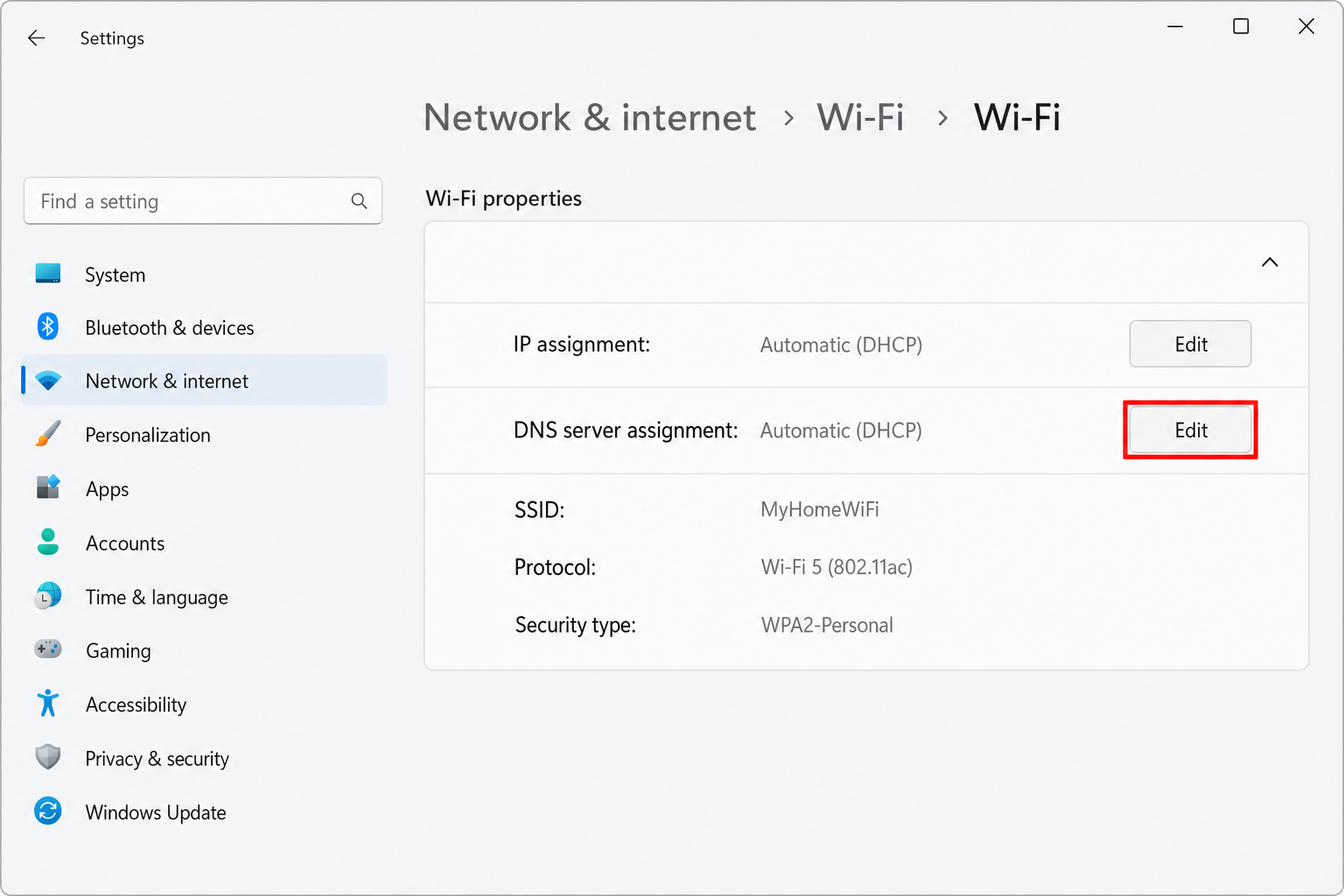 Windows 11 Settings > Network & internet > Wi-Fi properties page showing DNS server assignment section with Edit button highlighted