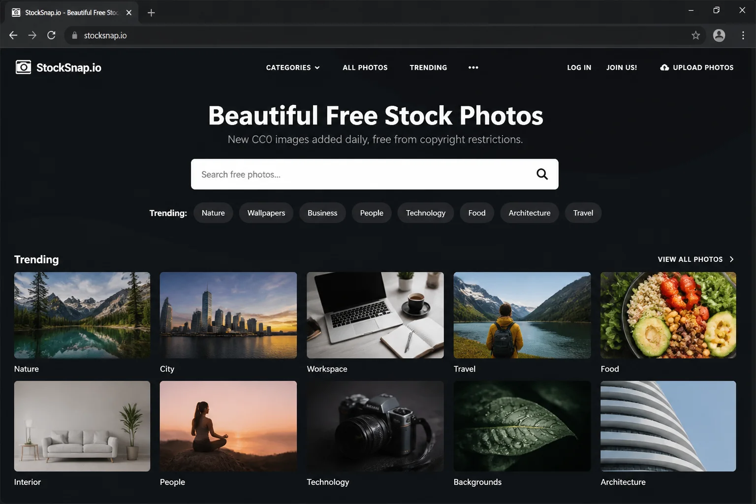 StockSnap.io homepage with search bar and trending free stock photos displayed in a grid layout