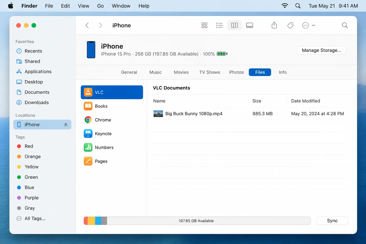 Finder with iPhone selected in sidebar, Files tab open showing VLC file sharing area with a video file