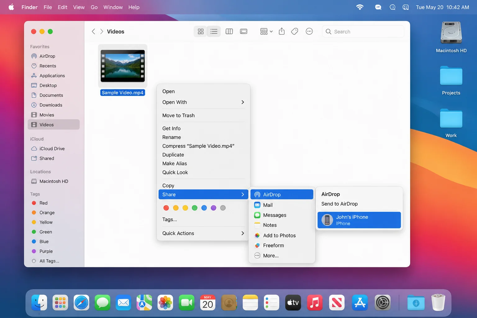 macOS right-click context menu on a video file with Share > AirDrop selected and an iPhone showing in the AirDrop recipient list