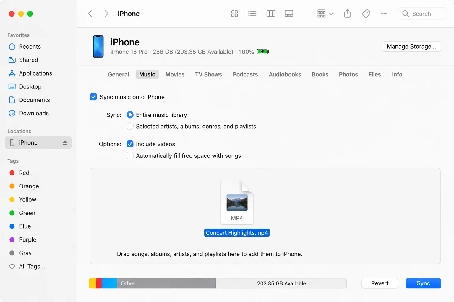 Finder window with iPhone selected in sidebar, Movies tab active, showing a dragged-in MP4 video file and Sync button visible