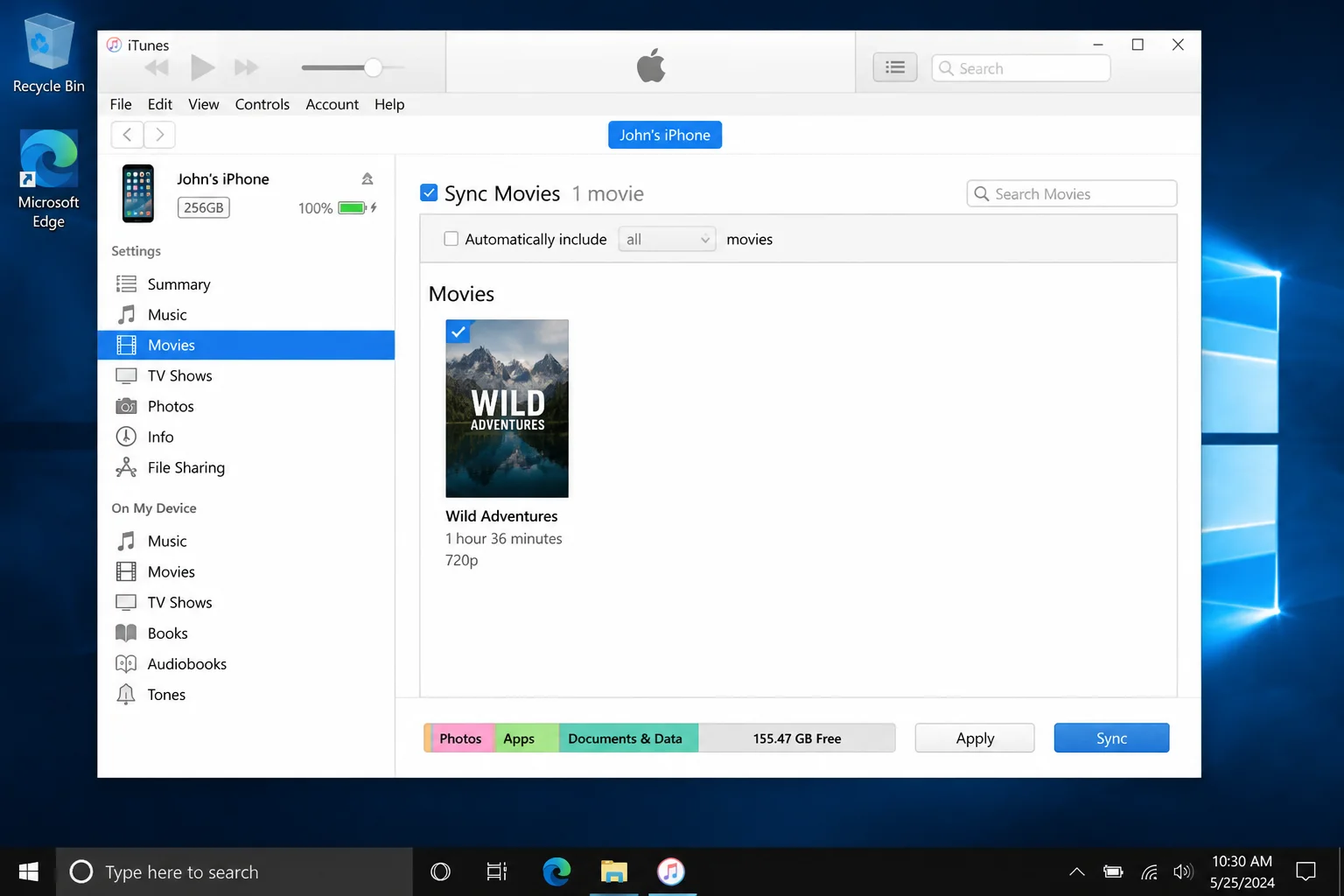 iTunes with iPhone connected, Movies section selected under On My Device, showing a video file in the library and the Sync button