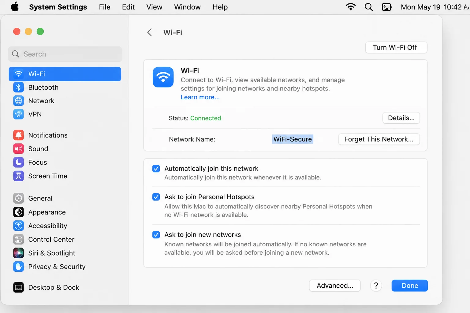 macOS System Settings Network panel showing Wi-Fi connection status and signal strength
