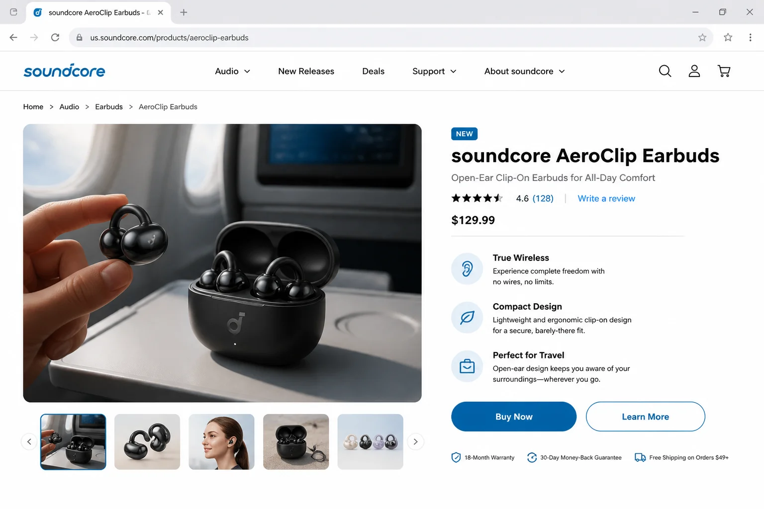True wireless earbuds with charging case shown open on an airplane tray table, with one earbud in the case and one being held up to show its design