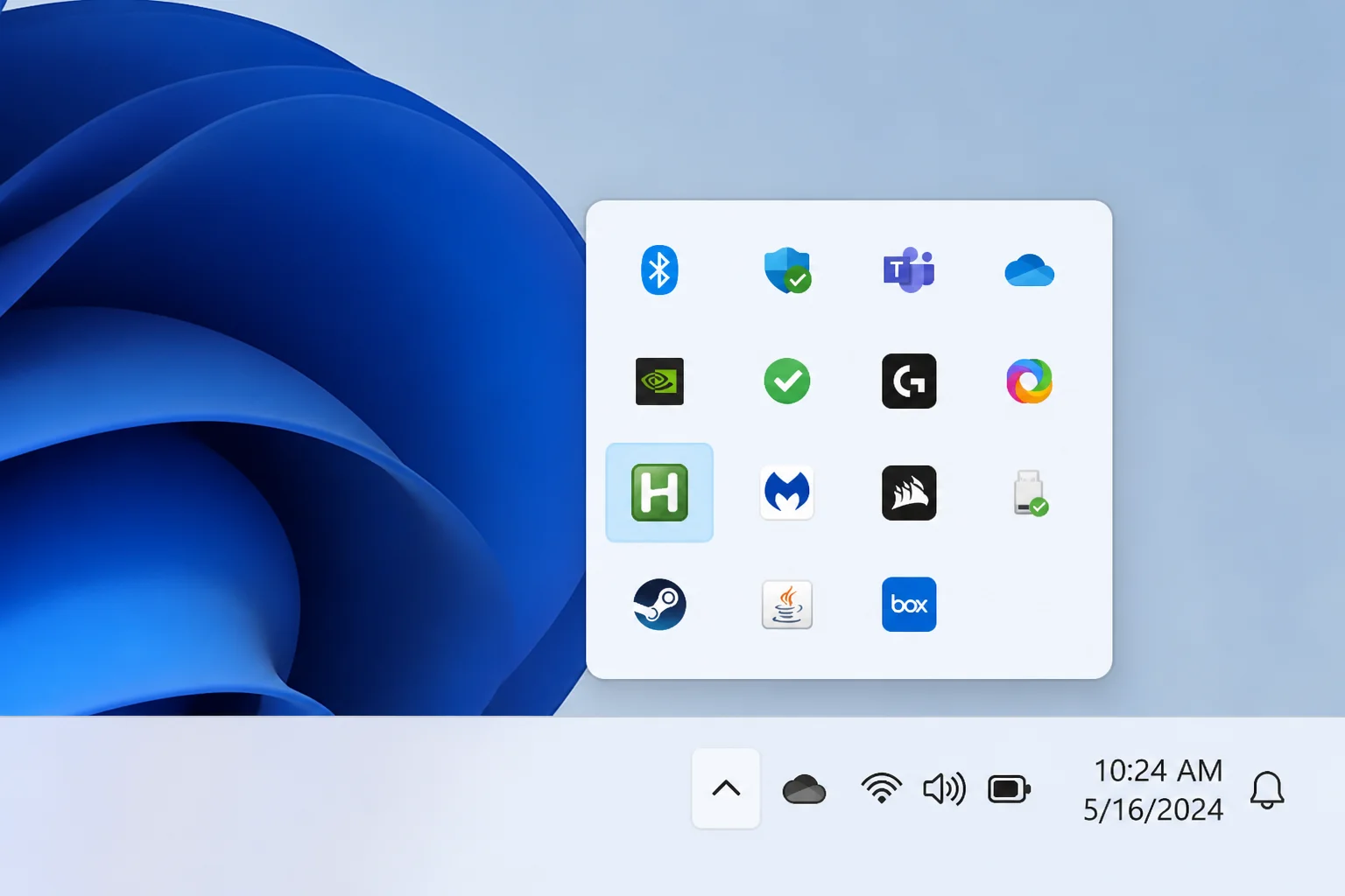 Windows 11 system tray with the overflow panel open, showing the green AutoHotkey H icon