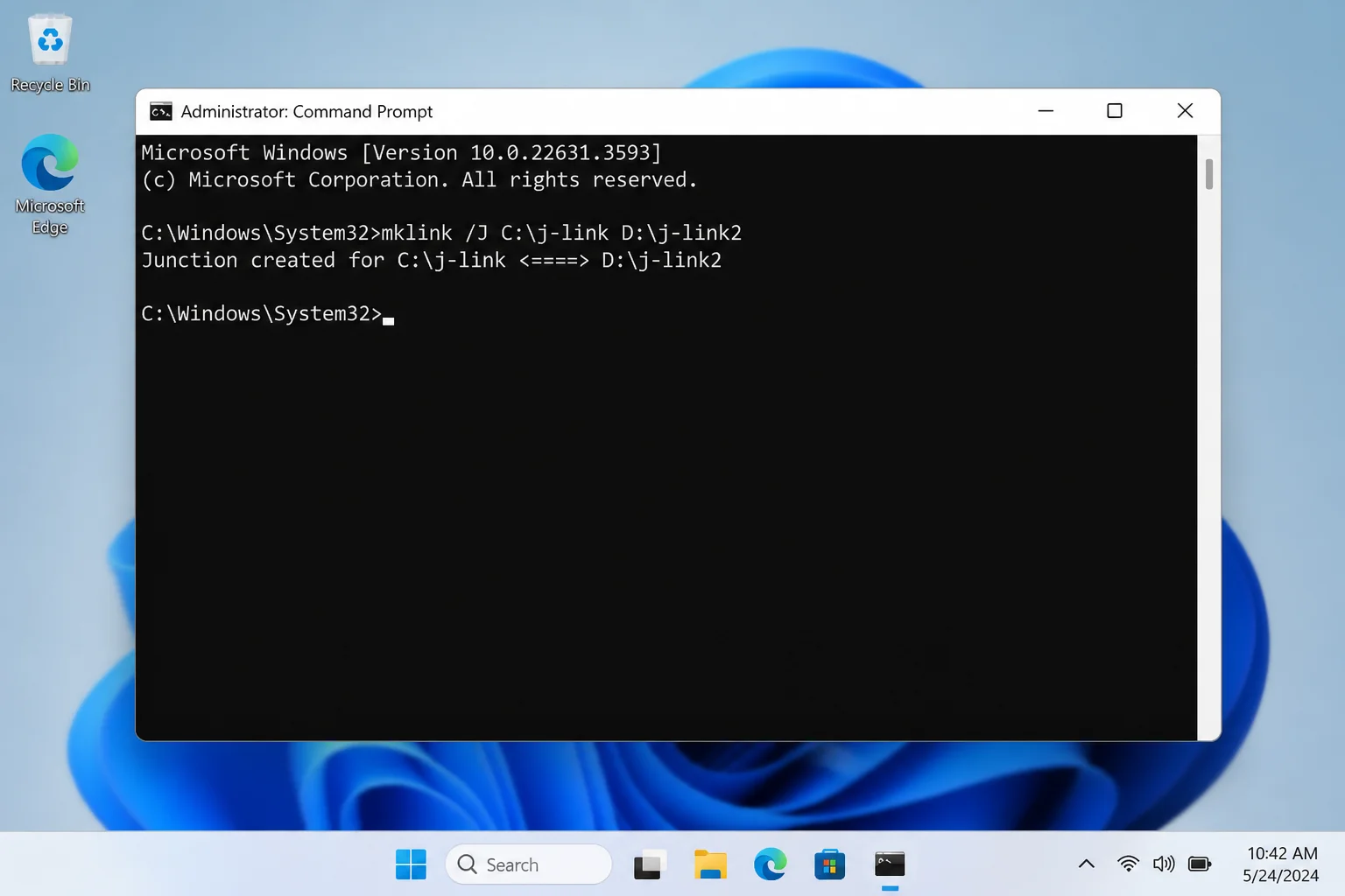 Windows 11 Command Prompt running as administrator with an mklink /J command visible and a Junction created success message