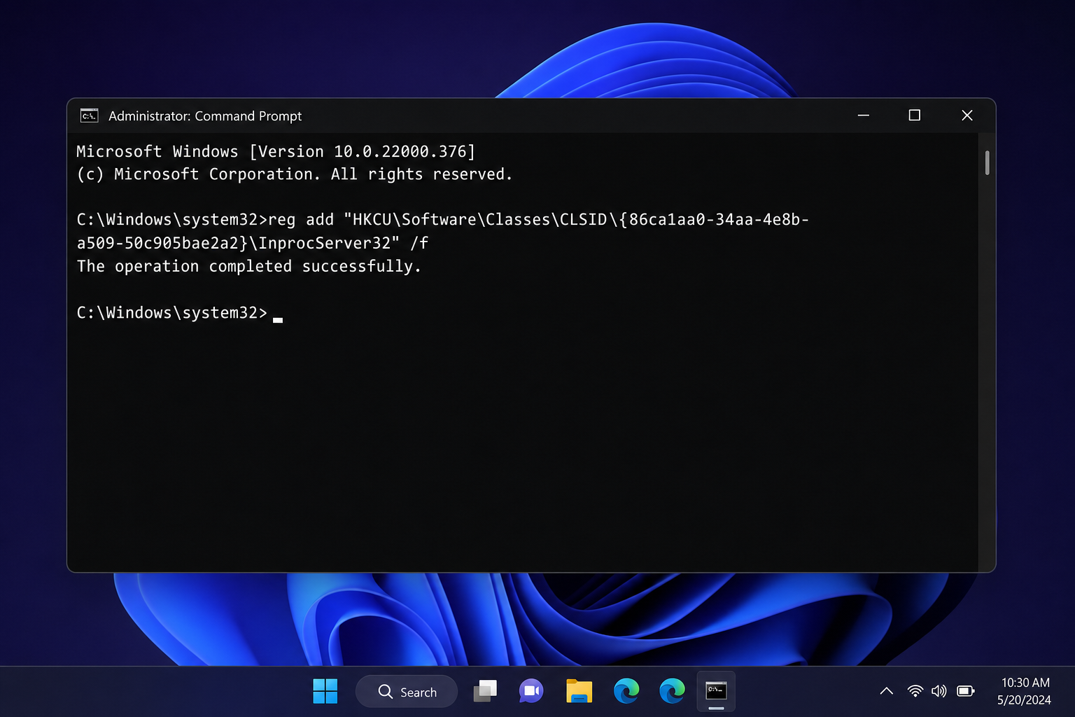 Command Prompt running the reg.exe add command to restore classic context menu in Windows 11