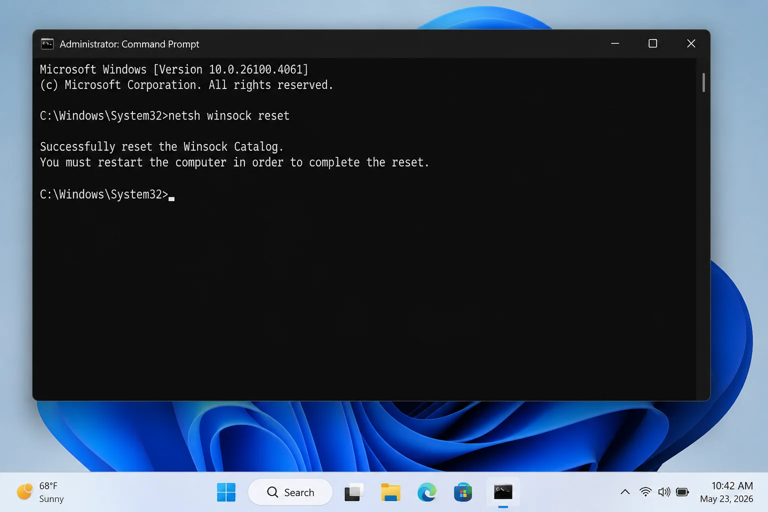 Command Prompt window showing netsh winsock reset command and successful completion message