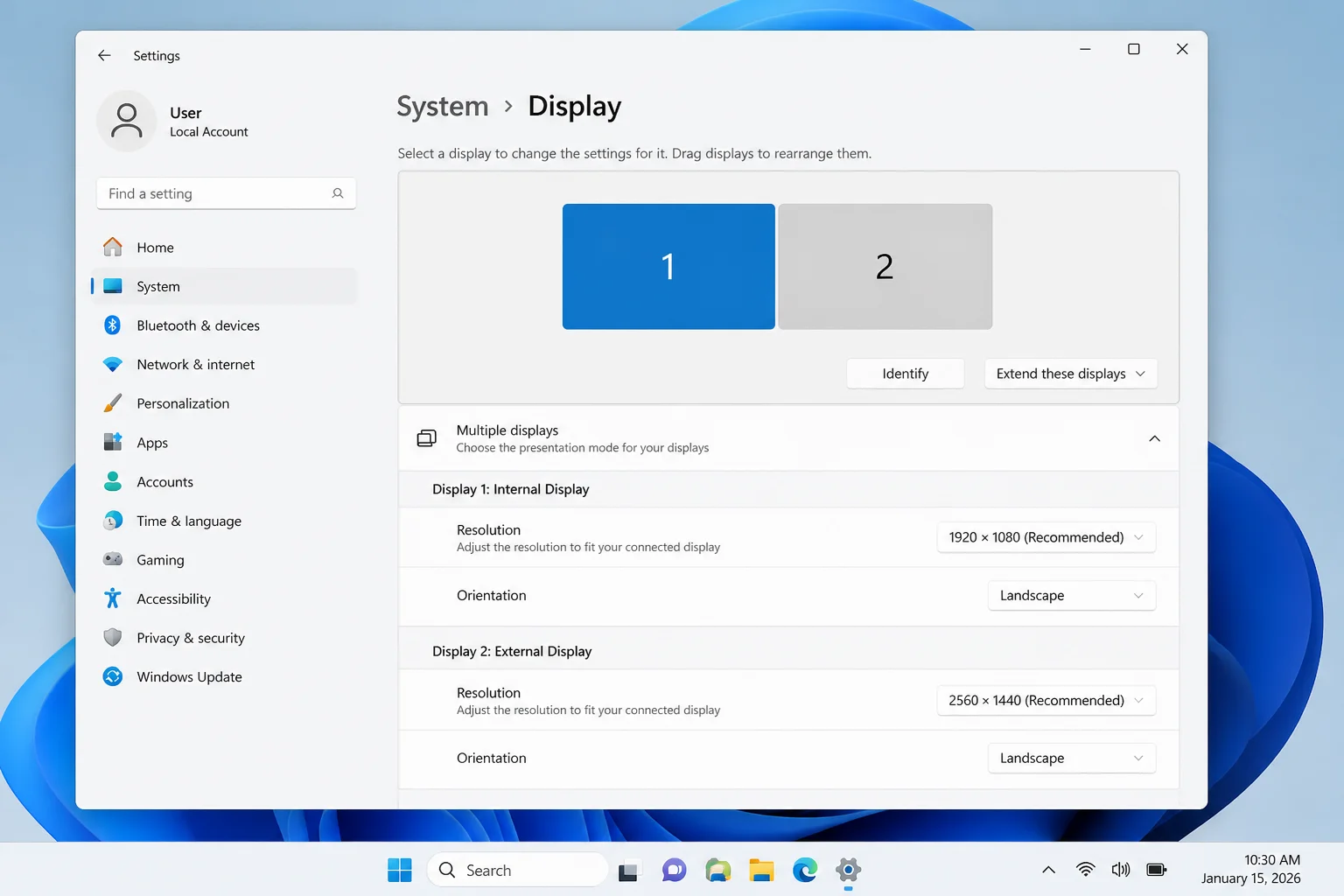 Two monitors connected to a Windows 11 PC shown in Windows Display Settings with both displays active and labeled Display 1 and Display 2