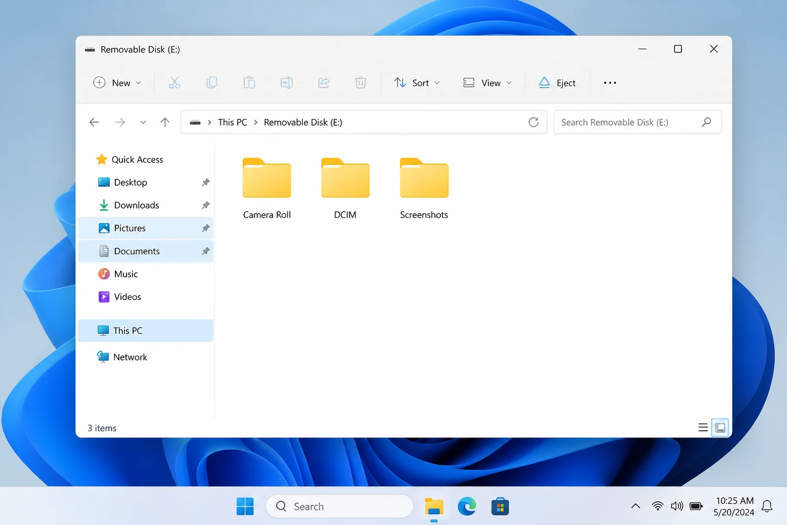 Windows 11 File Explorer showing an SD card containing test photos before deletion