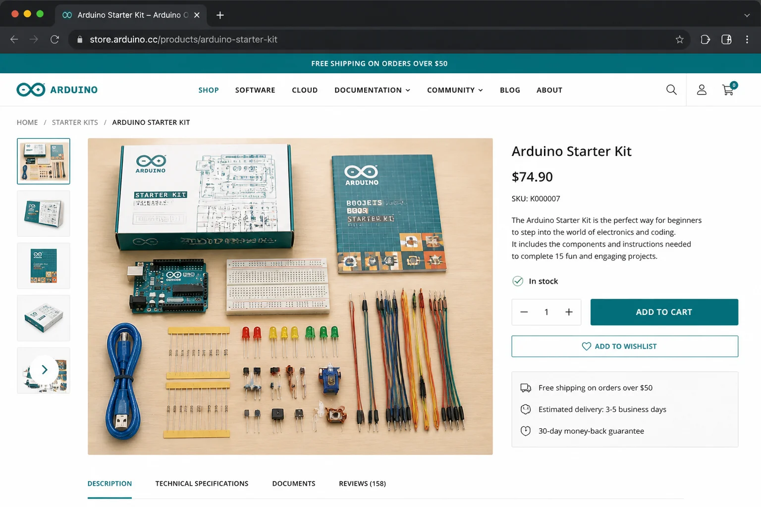 Arduino Starter Kit contents spread out on a table showing the Arduino Uno board, breadboard, electronic components, jumper wires, and the official project guide booklet
