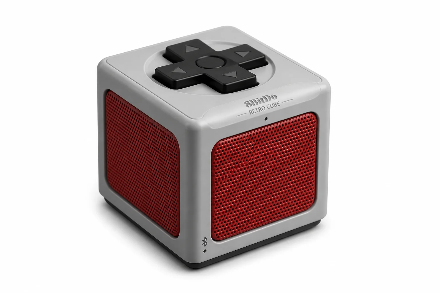 8BitDo Retro Cube Bluetooth speaker with NES-style D-Pad on top in gray colorway, styled to resemble a classic gaming controller form factor
