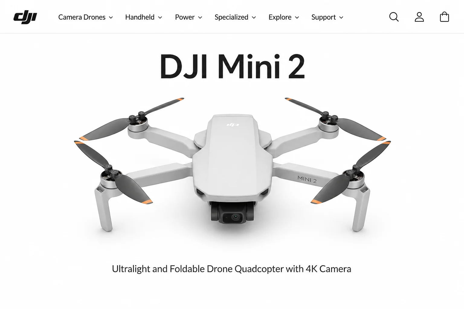 DJI Mini 2 drone with arms fully extended and propellers open, viewed from a slightly elevated diagonal angle