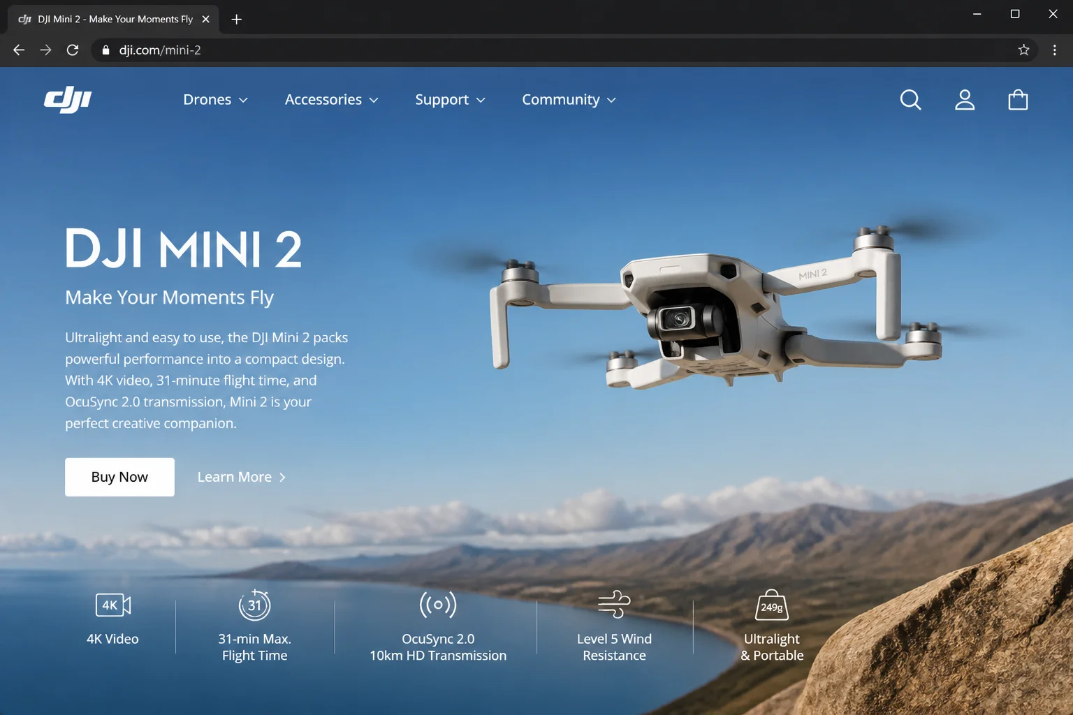 DJI Mini 2 drone in flight outdoors with arms and propellers fully extended against an open sky