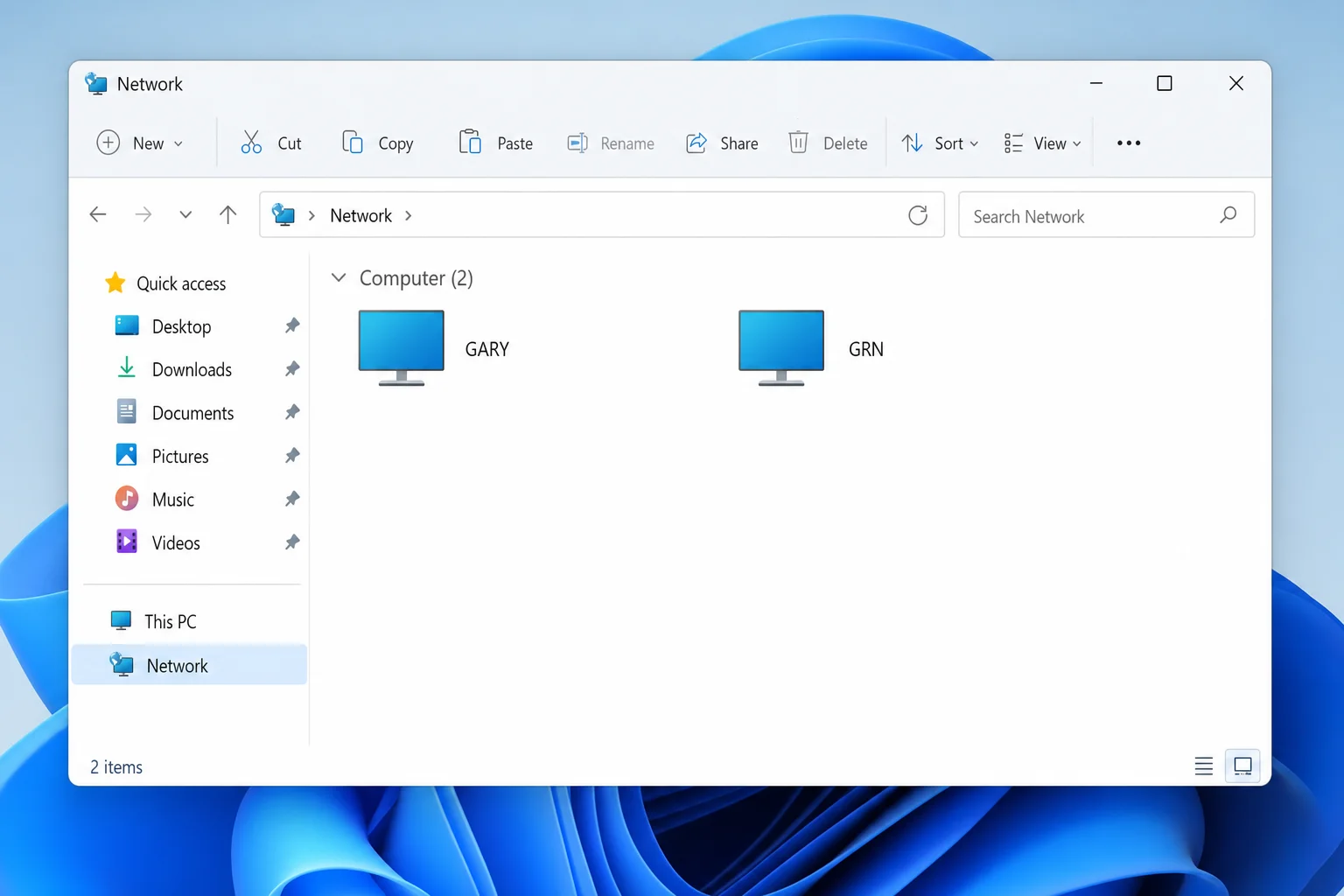 Windows 11 File Explorer showing two computers connected on the same local network under Network in the sidebar