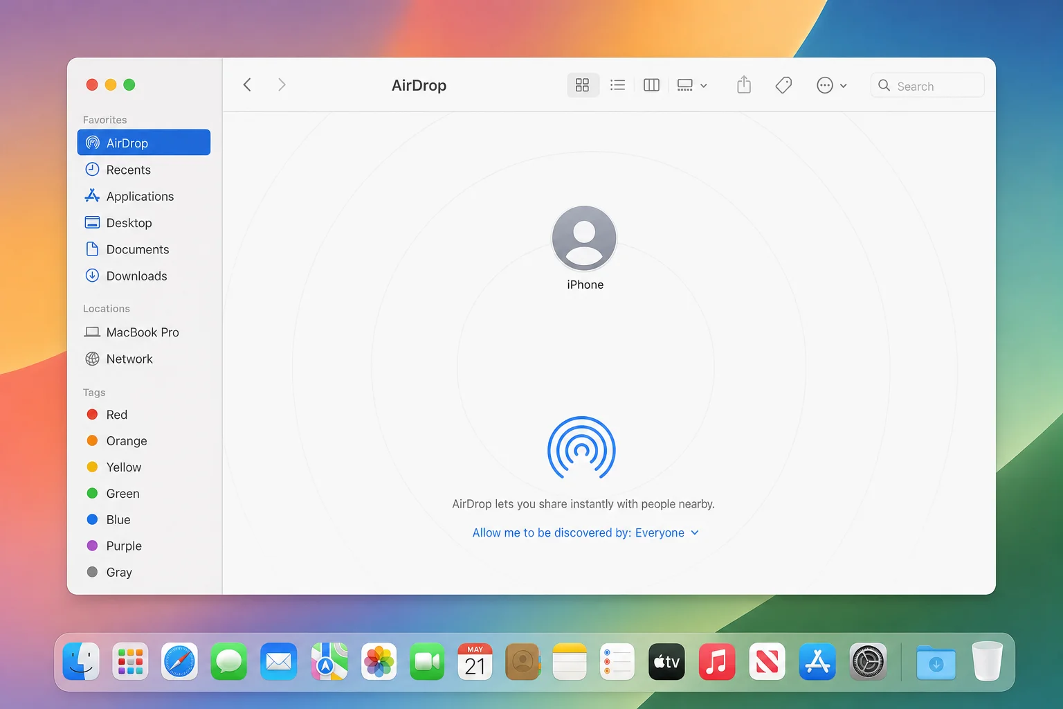 macOS Finder AirDrop window showing an iPhone as a nearby device ready to receive a file